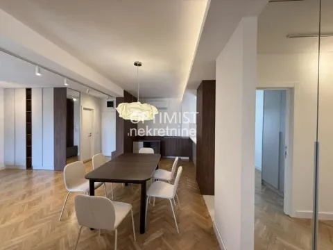 Living room with a dining area and modern furniture. - image 11