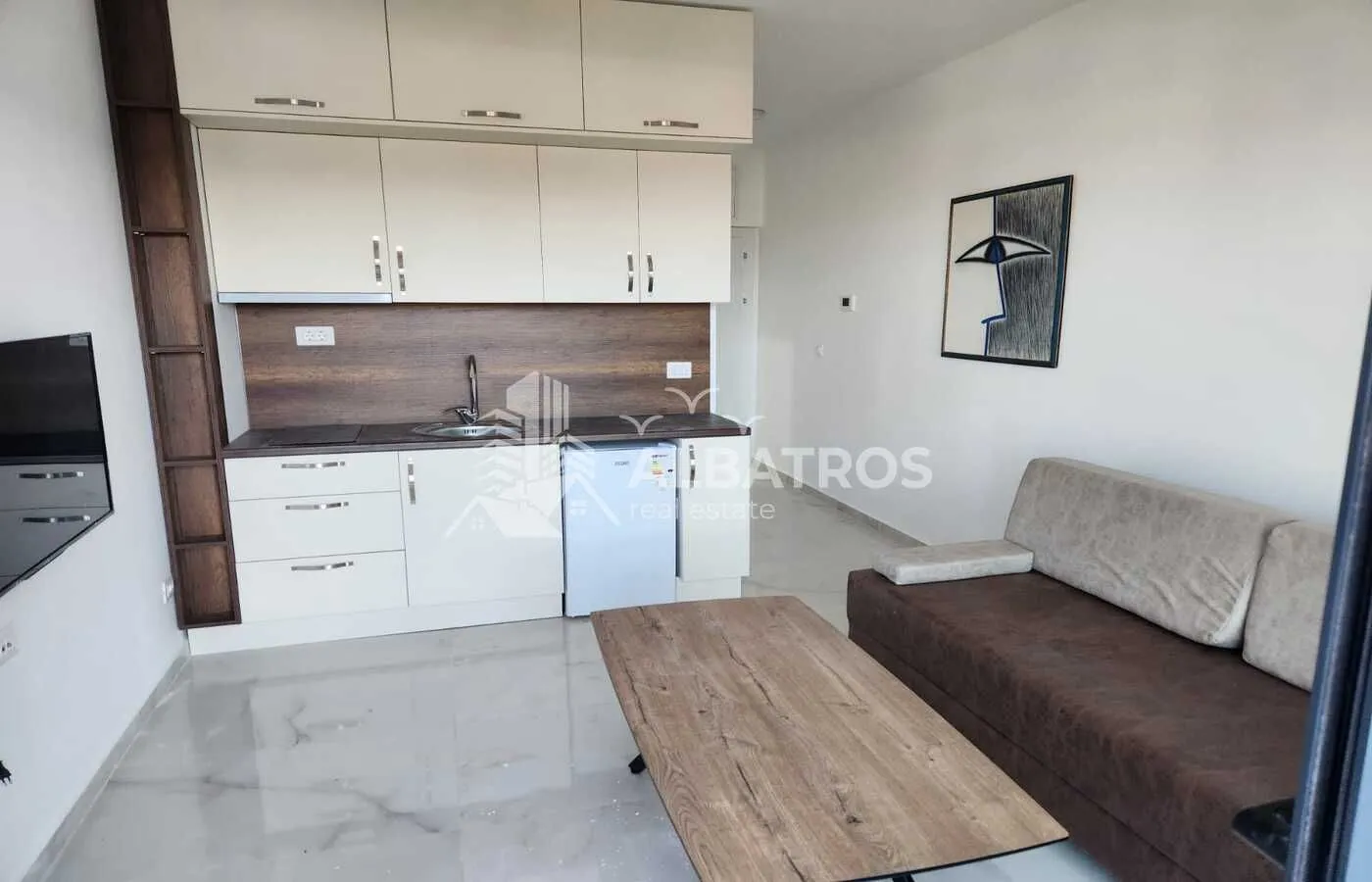 Living room with kitchen and dining area.