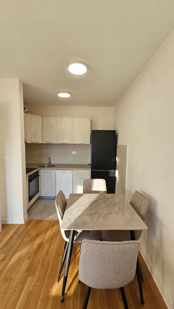 Small kitchen with a dining table and chairs.