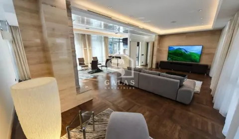 Spacious living room with a sofa set and a dining area in the background. - image 3