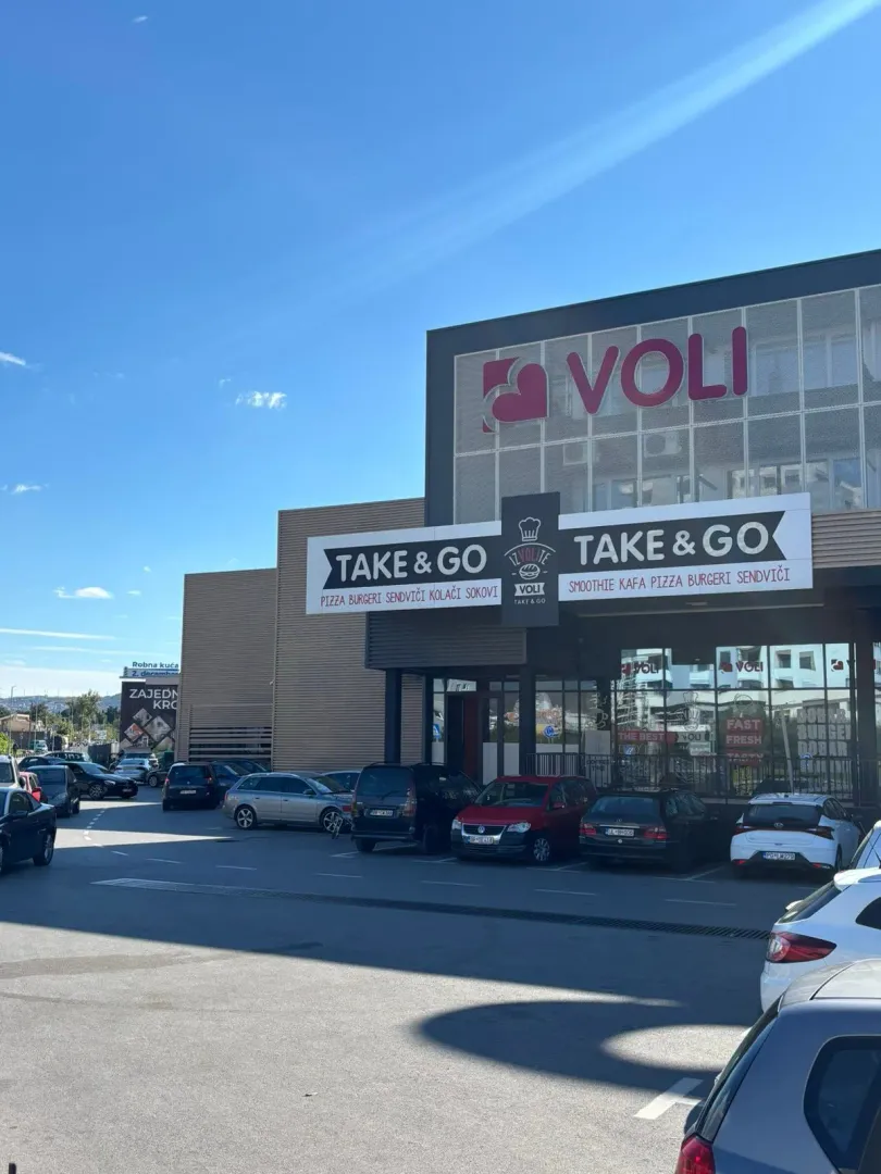 Exterior of a commercial building with parking in front.