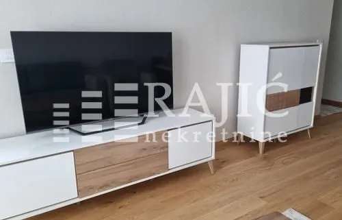 Living room with a TV unit and television.