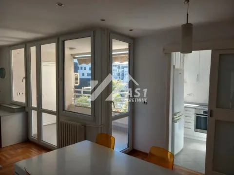 Living room with a dining table and a view of the terrace. - image 4
