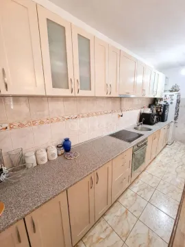 Fully equipped kitchen with light wooden cabinets and granite countertop. - image 7
