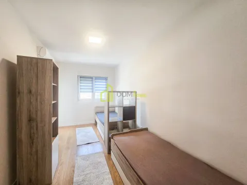 Children's bedroom with two beds, wardrobe and a window. - image 12