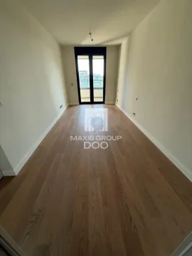 Empty room with wooden flooring and access to a terrace. - image 8