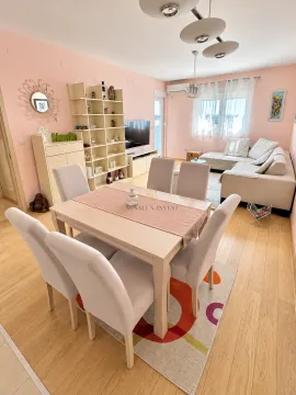 Living room with a dining area and a sofa set. - image 2