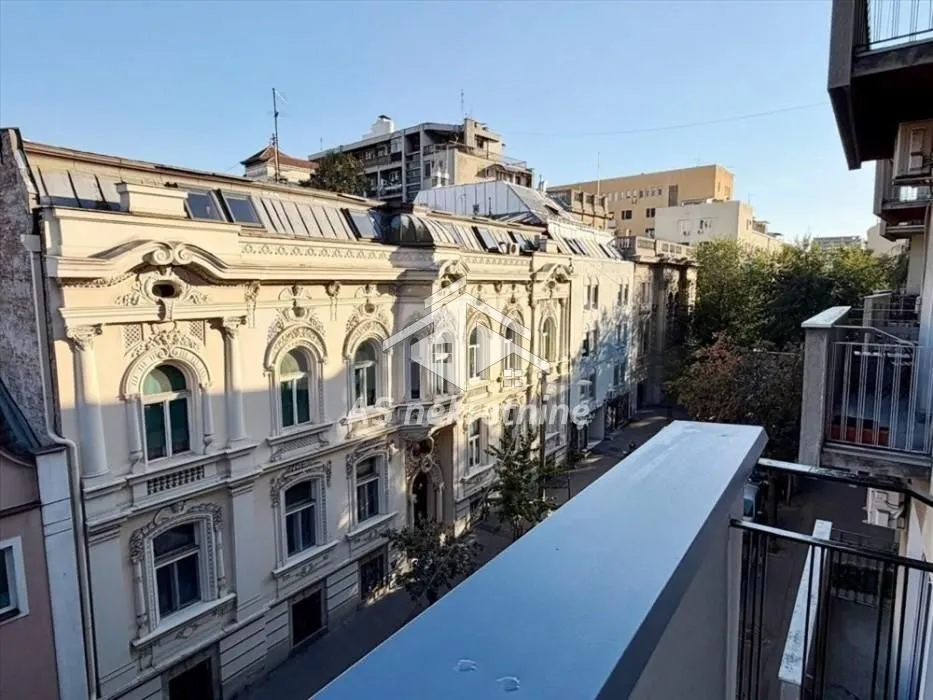 View from the terrace of the surrounding buildings and city street.