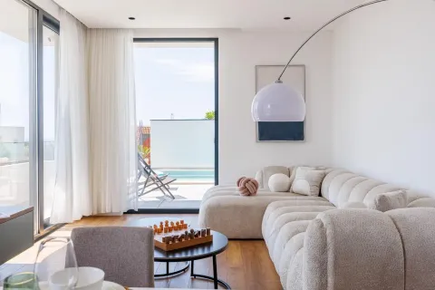 Bright and modern living room with access to the terrace and swimming pool. - image 17