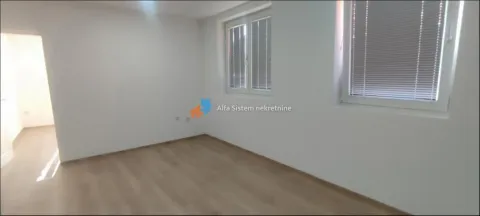 Empty unfurnished room with white walls and two windows. - image 3
