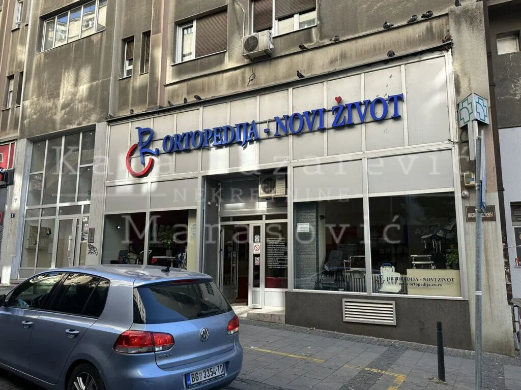Street view of the commercial space facade and entrance with signage.
