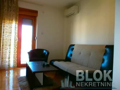 Living room with sofa, coffee table and access to the terrace. - image 2