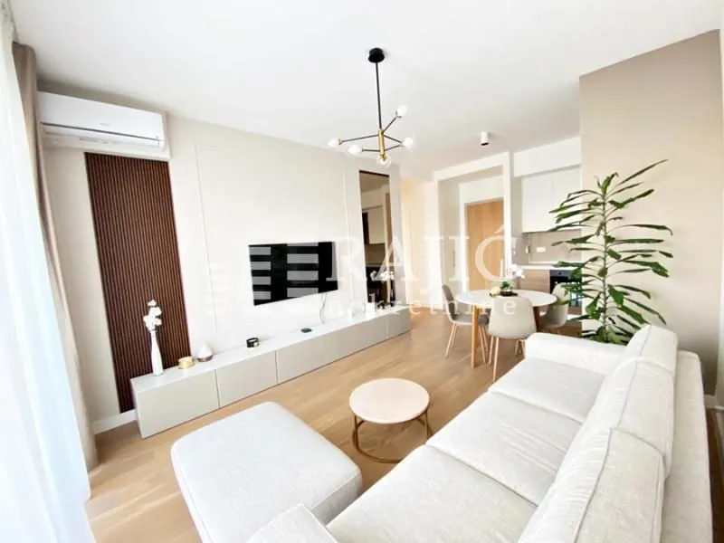 Modern and bright living room with a dining area.