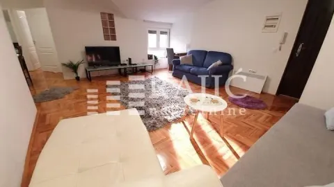 Spacious living room with a sofa set and parquet flooring. - image 13