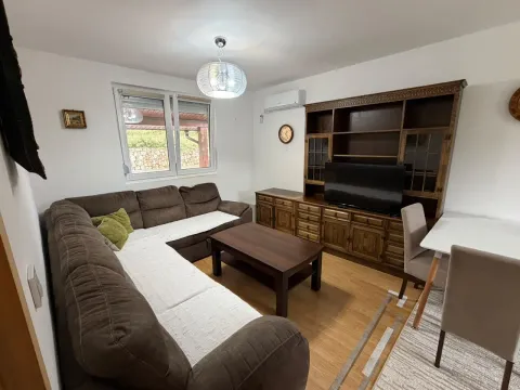 Living room with sofa set, wooden furniture and dining table. - image 2