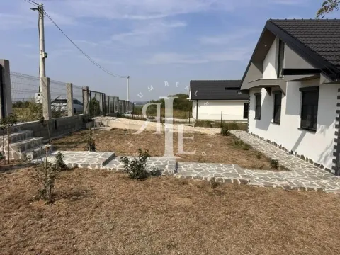 View of the yard and exterior of the house with paved pathways. - image 16