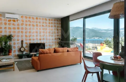 Spacious living room with dining area and sea view. - image 19