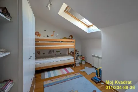 Children's bedroom with a bunk bed and a skylight. - image 7