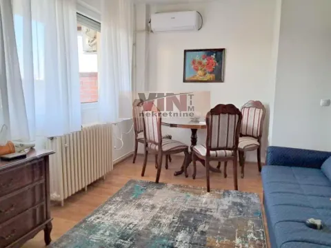 Living room with a sofa set, dining table, and window. - image 6