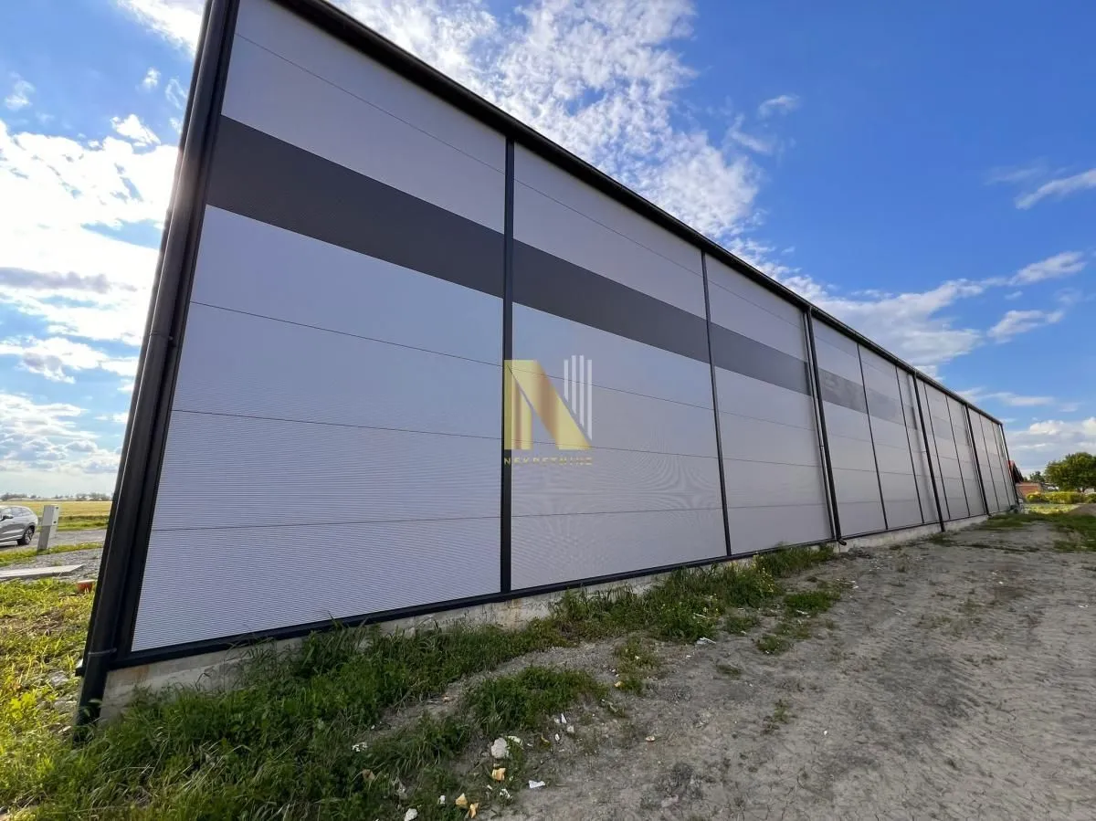 View of the exterior of a modern industrial hall with a panel facade.