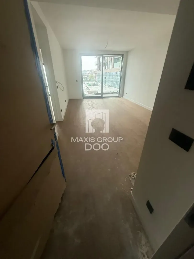 Empty unfinished room under construction with a view of the terrace.