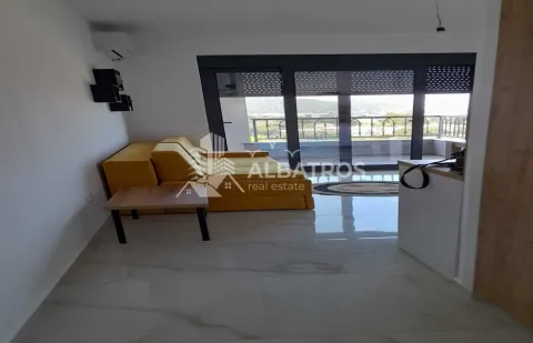 Living room with a yellow sofa and access to the terrace. - image 2