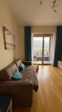 Living room with a sofa and access to the terrace. - image 5