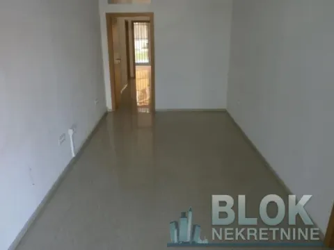An empty unfurnished room with light floor tiles and white walls. - image 7