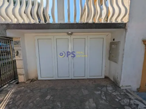 Exterior of the house with white entrance doors and a balcony. - image 8