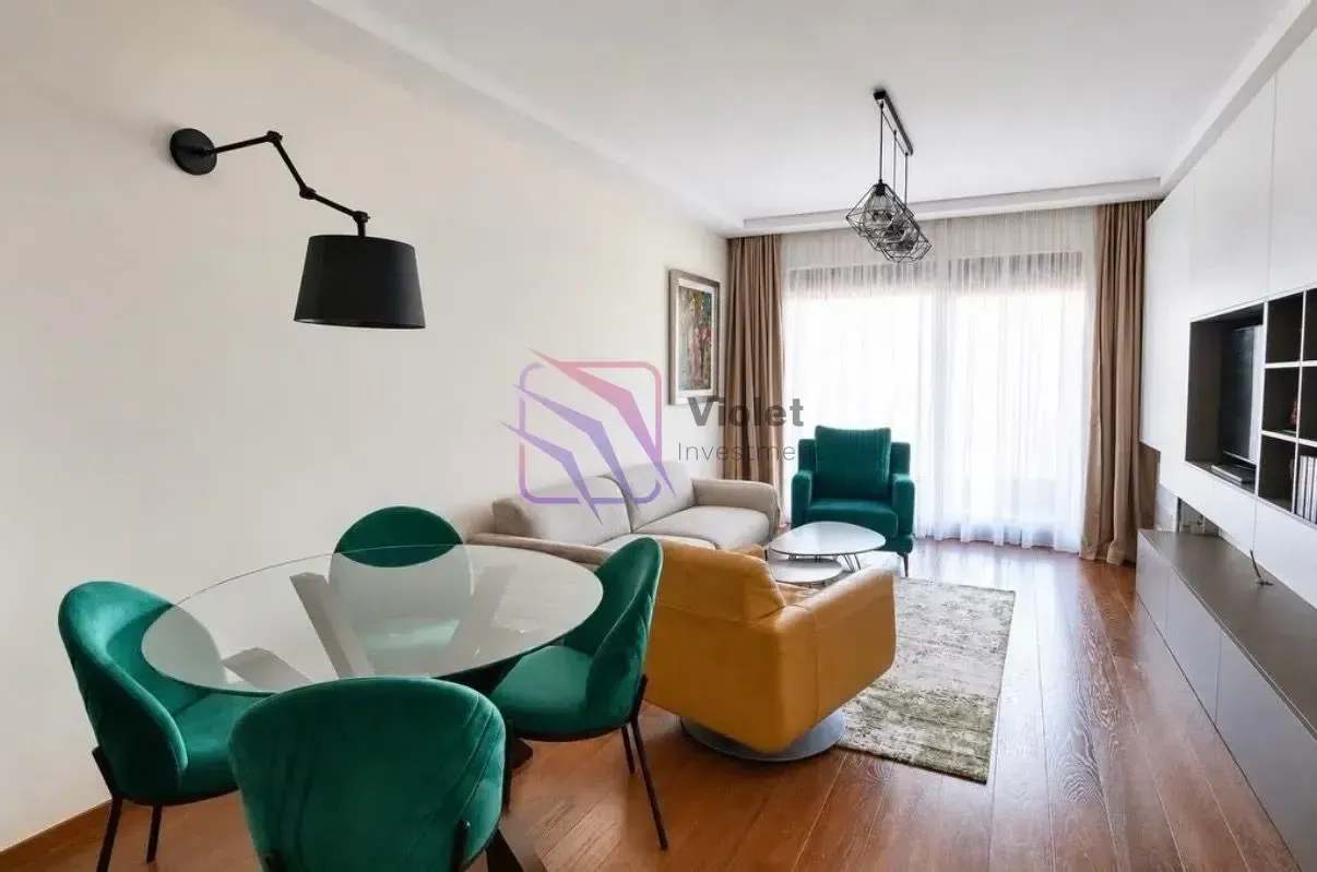 Living room with dining area and modern furniture.