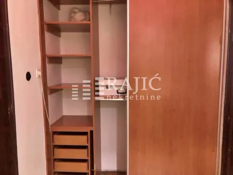 Built-in wardrobe with shelves and drawers in the room. - image 7