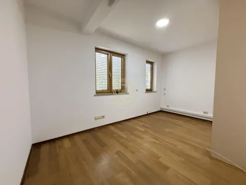 Empty room with white walls, wooden flooring and windows. - image 6