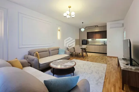 Living room with a sofa set and dining area as part of an open-plan space with the kitchen. - image 16