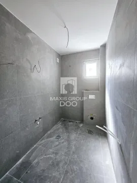 Unfurnished bathroom with grey tiles and installed plumbing. - image 6