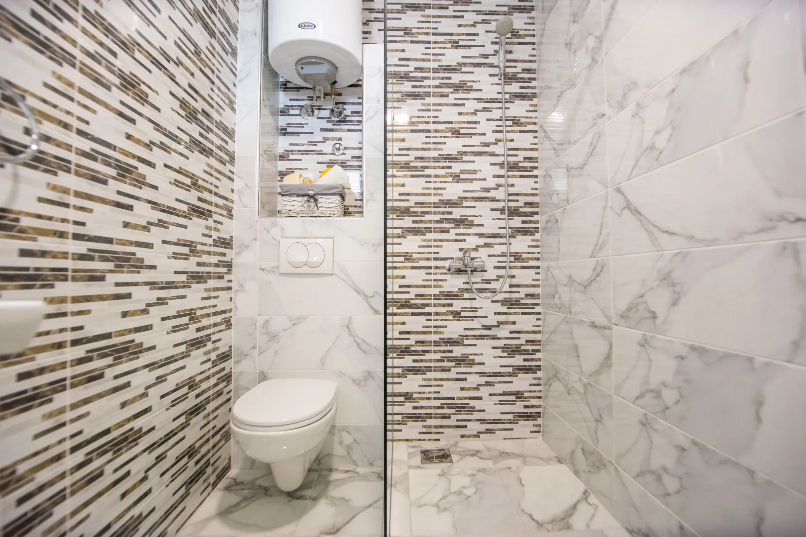 Modern bathroom with a walk-in shower and built-in sanitaryware.