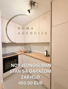 Modern kitchen within a one-bedroom apartment. - image 4
