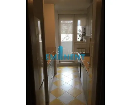 Smaller kitchen with cabinetry and access to the terrace. - image 6