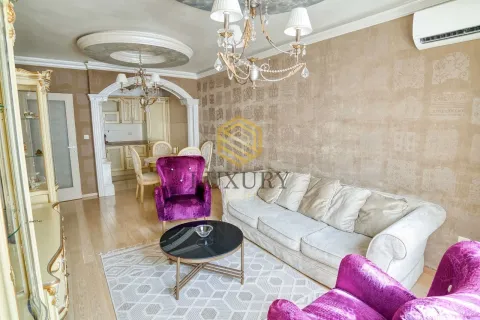 Spacious living room with sofa set and a view of the dining area. - image 11