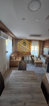 Living room with a sofa set and a dining table. - image 18