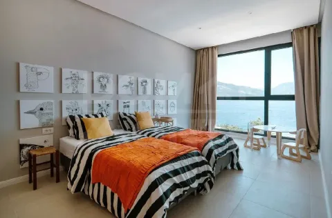 Children's bedroom with two beds and a sea view. - image 2