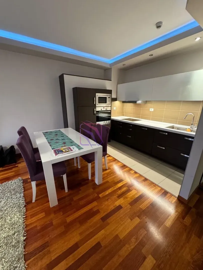 Kitchen with a dining area and modern furniture.