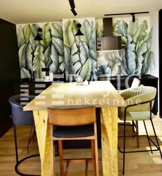 Modern kitchen with a dining table and chairs. - image 6