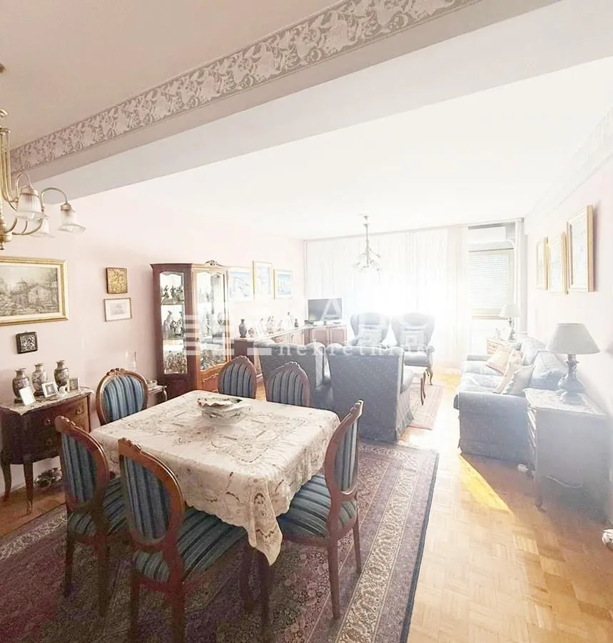 Spacious living room with a dining area and seating set.