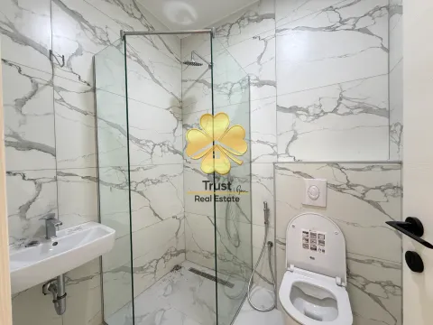 Modernly equipped bathroom with a walk-in shower. - image 7