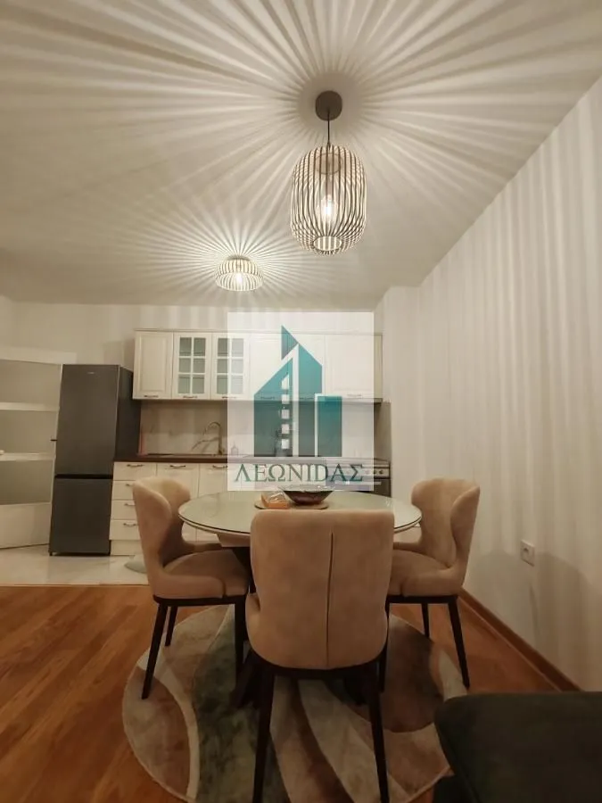 Dining area with table and chairs connected to the kitchen.