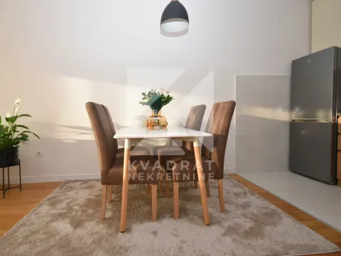 Dining table with chairs as part of the kitchen area. - image 9