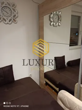 Living room with a sofa set and a large mirror on the wardrobe. - image 5