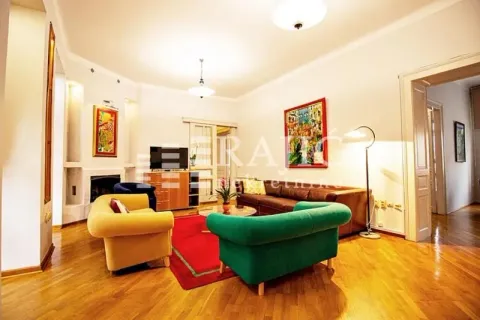 Spacious and bright living room with seating furniture and parquet flooring. - image 2