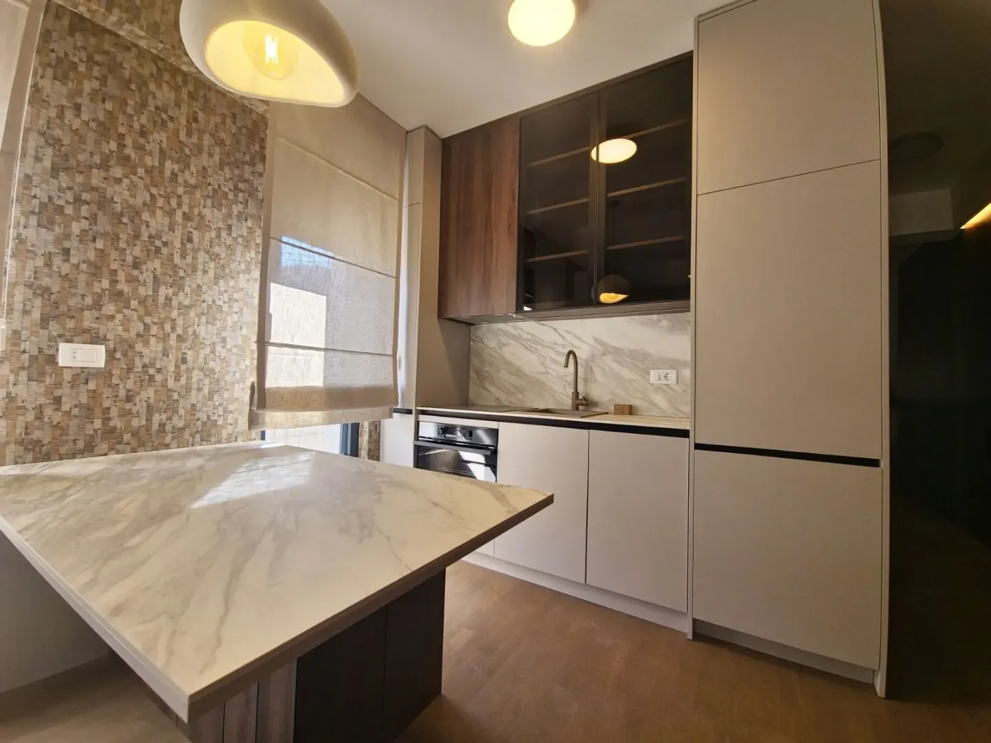 Modern kitchen with built-in cabinetry and a dining table.