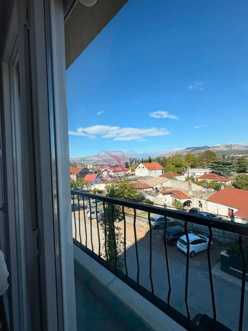 View from the balcony overlooking the neighborhood and surrounding mountains.